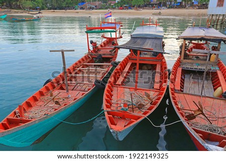 View of a typical cambodian long-tale boat anchored on the pier near Sihanoukville. This boat is used for the touristic transfer from the mainland to the touristic island of Koh Rong, Koh Rong Sanloem
