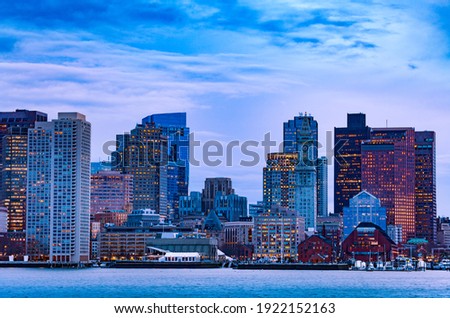 Evening panorama of Boston downtown from Main channel with marina and illuminated skyscrapers