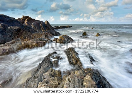 Rocks and sea located at Terengganu Malaysia. soft effect, slow shutter speed.