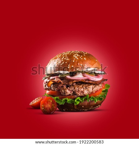 
Typical fast food, a burger served with cheese and salad. isolated on red background.fit for design element. Royalty-Free Stock Photo #1922200583