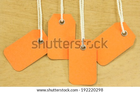 blank price tag hang on wooden background