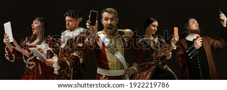 Modern tech devices. Medieval people as a royalty persons in vintage clothing on dark background. Concept of comparison of eras, modernity and renaissance, baroque style. Creative collage. Flyer Royalty-Free Stock Photo #1922219786
