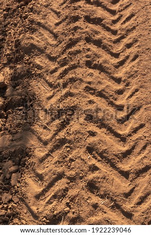 Tractor tracks on arid and dry terrain in southern Andalusia in Spain