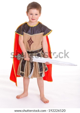 Little cute smiling boy dressed as a knight, isolated on white background