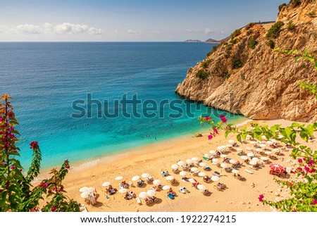 Kaputas beach with blue water on the coast of Antalya region in Turkey with sun umbrellas on the beach. Travel destination Royalty-Free Stock Photo #1922274215