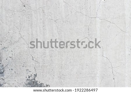Concrete wall, cracks all over the surface