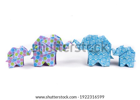 Elephant family in origami technique on  white background