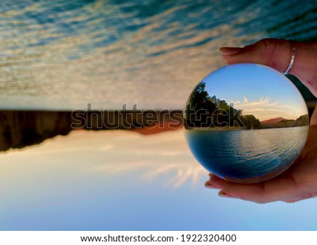 Picture of a lake through a lensball