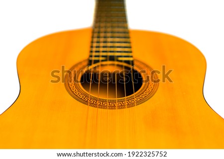 Acoustic guitar isolated on white, close up. Classical Guitar Standing On White Background. Selective focus 