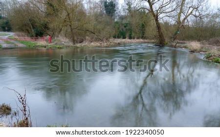 a large pool, river scene with water flowing by in a time-lapse blur sheen