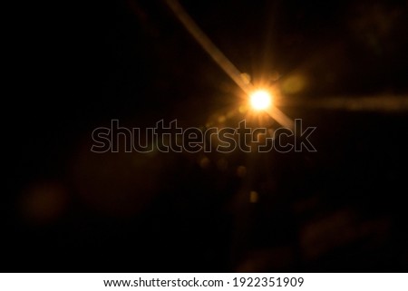 Abstract Natural Sun flare on the black Royalty-Free Stock Photo #1922351909