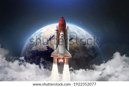 Spaceship in the outer space on orbit of Earth planet. Space shuttle in sky with clouds. Continents and oceans. Elements of this image furnished by NASA
