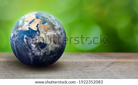 Earth planet sphere on green leaves background. Ecology and environment care concept. Greenpeace and Earth day theme. Elements of this image furnished by NASA
 Royalty-Free Stock Photo #1922352083