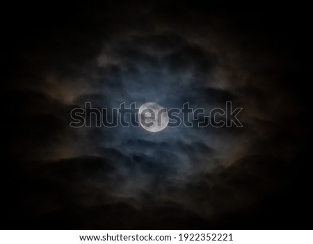 A cloudy blue moon night