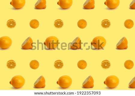 Fruit pattern. Colorful of fresh slices of lemon texture on a yellow background. Top view. Photo collage. A minimal summer fruit template for a blog or recipe book.
