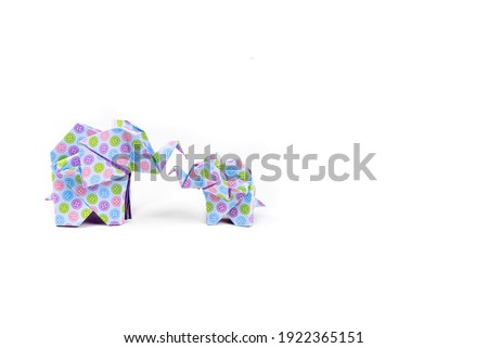 elephant family in origami tehnique on the white background