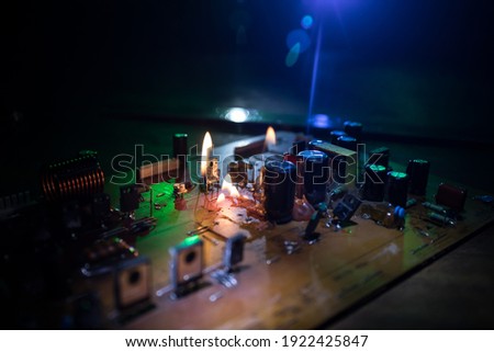Burning microcircuit of complex electronic equipment. Factory breakdown concept. Breakdown of a new microcircuit. Selective focus