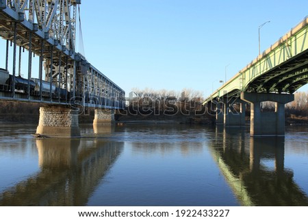 Two bridges with reflection at Berkley Riverfront in Kansas City, Missouri Royalty-Free Stock Photo #1922433227