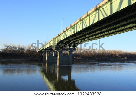 Bridge reflection in Missouri River at Berkley Riverfront in Kansas City, Missouri Royalty-Free Stock Photo #1922433926