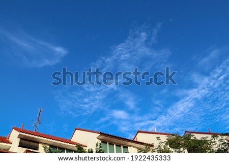 Singapore's tropical climate and bright morning sunshine create cumulus clouds with faces, birds or dragons. Cumulus clouds are dense, flat and detached looking like white fluffy cotton balls.