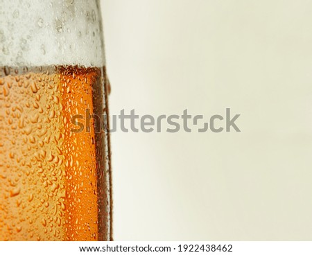 panoramic picture with part of a glass of beer