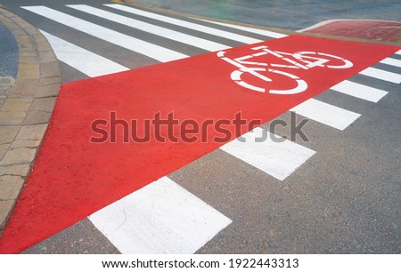 A Road with freshly painted zebra crossing and bicycle lane