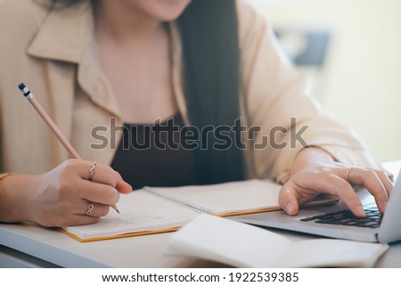 Closeup woman hands using computer laptop. Royalty-Free Stock Photo #1922539385