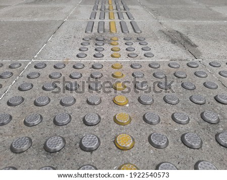 The sidewalk has well-maintained guiding block facilities. Guiding block is a ceramic that has a special design in texture that is intended to help direct the blind to walk.