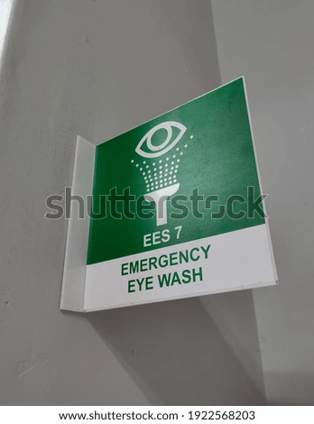 Selective focus.An emergency eye wash sign in a laboratory.Shot were noise and artifacts.
