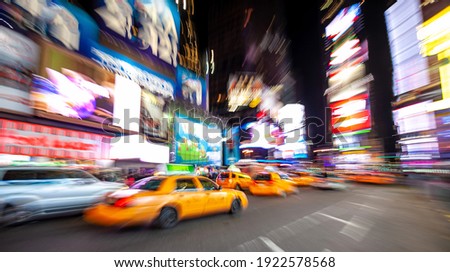 Slow shutter speed blur and zoom techniques. Abstract photo 0f yellow taxi in Manhattan, New York City  in USA slow 
