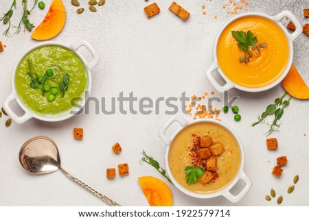 Set of vegetables soups. Pumpkin , green peas , lentil soup with ingredients. Dishes, food. Top view.