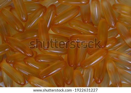 pile of omega 3 and vitamin d capsules background