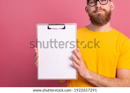 young man look out eyes white empty blank billboard for promotional content isolated studio shot
