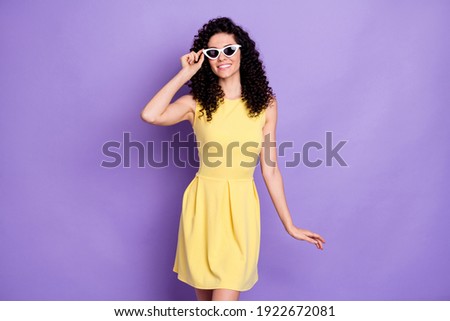 Photo of confident pretty lady toothy beaming smile wear sunglass yellow mini dress isolated violet background