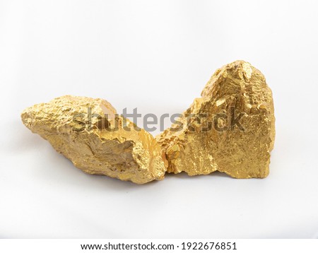 Two gold rock isolated on white background.
