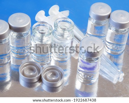 many bottles of covid-19 coronavirus vaccine, production medicine vaccine, closeup