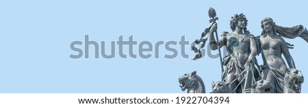 Banner with old statue of Dionis and Aridna quadriga with four panthers on the top of the State Opera House in downtown of Dresden, Germany, details, closeup, with copy space