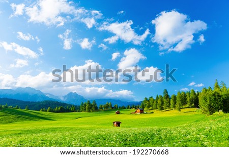 Beautiful landscape of valley in Alpine mountains, small houses in Seefeld, rural scene, majestic picturesque view in sunny day Royalty-Free Stock Photo #192270668