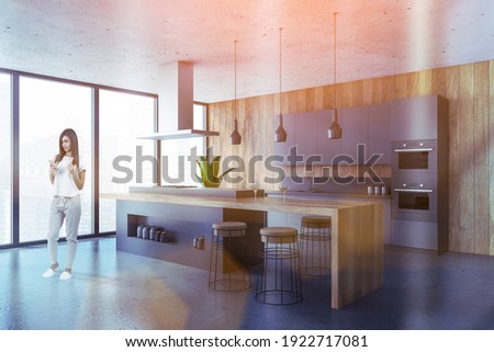 Woman at kitchen room with furniture and window, side view, lens flare. Businesswoman with phone in luxury dining room, marble floor, toned image 3D rendering no people