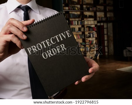 Lawyer shows info about Protective Order rules. Royalty-Free Stock Photo #1922796815