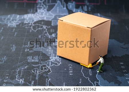 miniature people move parcel box on world map background