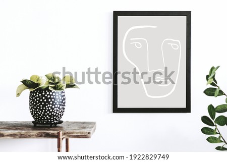 Stylish scandinavian interior of living room with wooden console, mock up poster frame and beautiful plants. Modern composition of home interior.  Template.