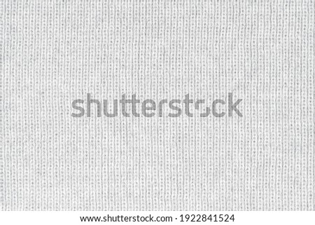 White natural texture of knitted wool textile material background. White crochet cotton fabric woven canvas texture. close up Royalty-Free Stock Photo #1922841524
