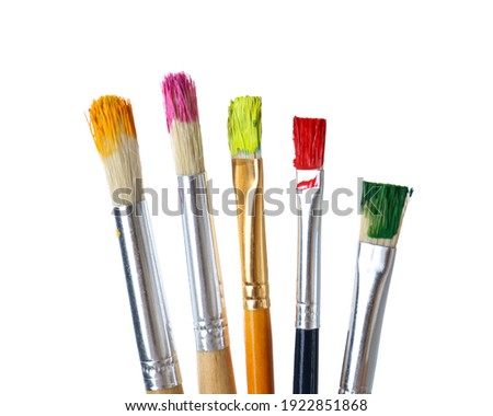 Different brushes with paints on white background Royalty-Free Stock Photo #1922851868