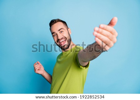 Photo of charming happy man invite you give hand positive smile isolated on pastel blue color background Royalty-Free Stock Photo #1922852534