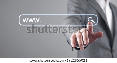 Male hand pressing Search button. Internet