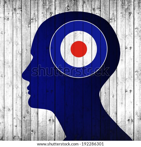 English mod target with human head and wood background 