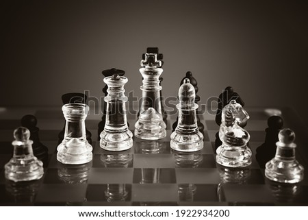 white  and black chess on black background. Image with selective focus. 
