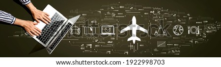 Flight ticket booking concept with person using a laptop computer