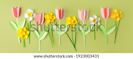 Happy Easter paper craft for kids. Paper DIY seasonal flowers tulips pastel green background. Spring decor, reate art for children, daycare, kindergarten, flyer greeting card, holiday concept Royalty-Free Stock Photo #1923003431